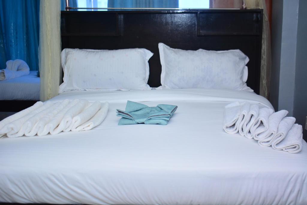 Postel nebo postele na pokoji v ubytování BRIMAK HOTEL