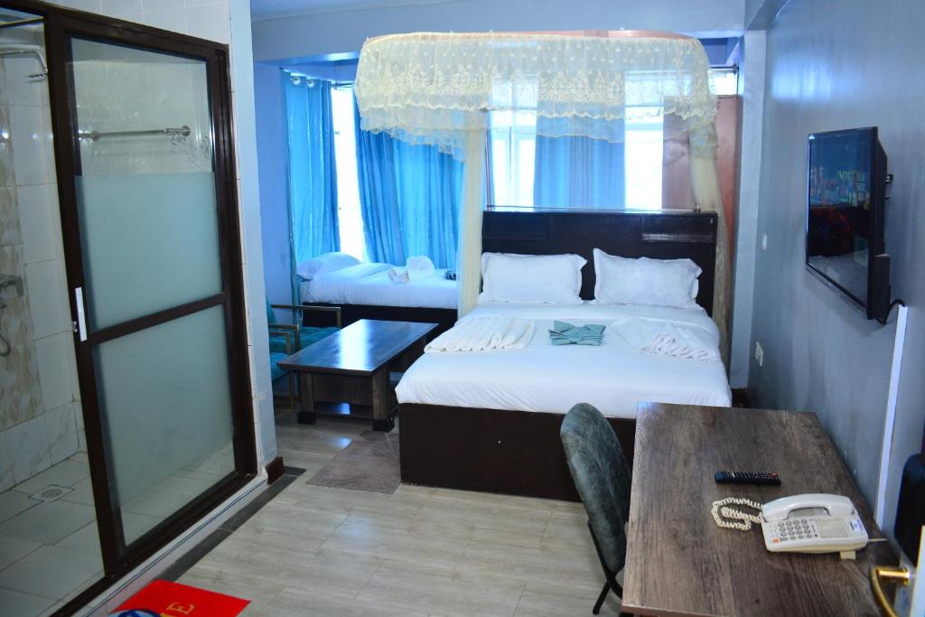 Postel nebo postele na pokoji v ubytování BRIMAK HOTEL