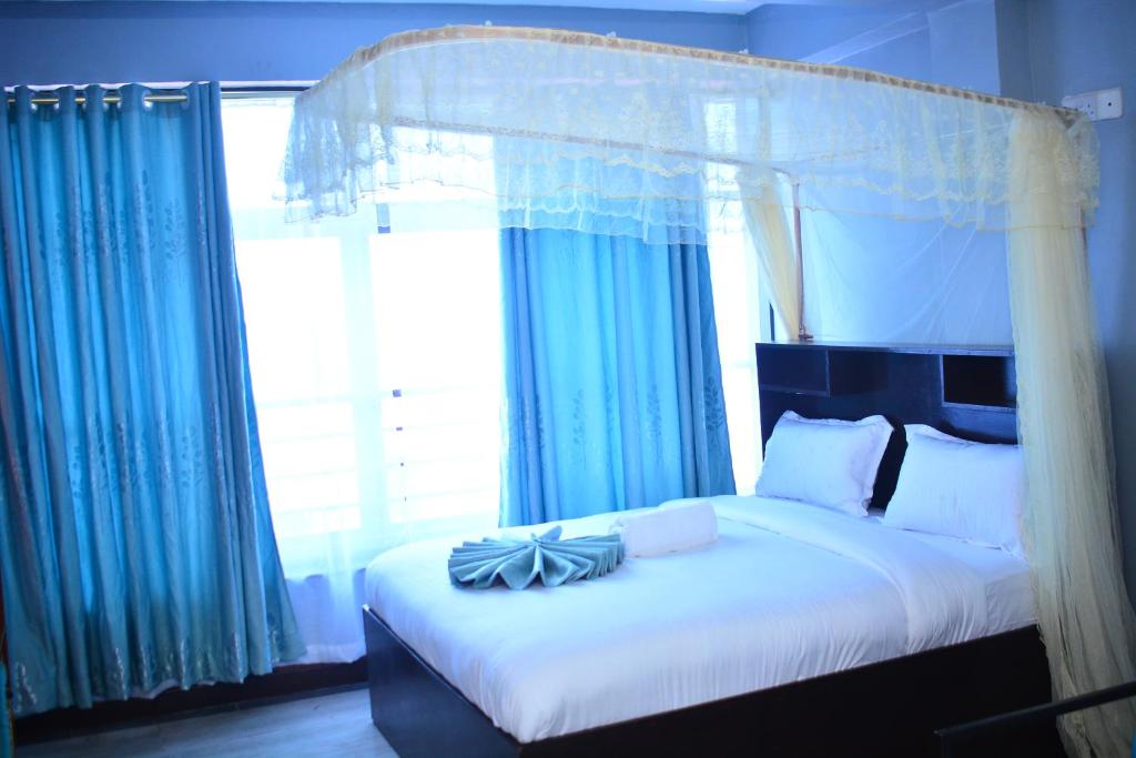 Postel nebo postele na pokoji v ubytování BRIMAK HOTEL
