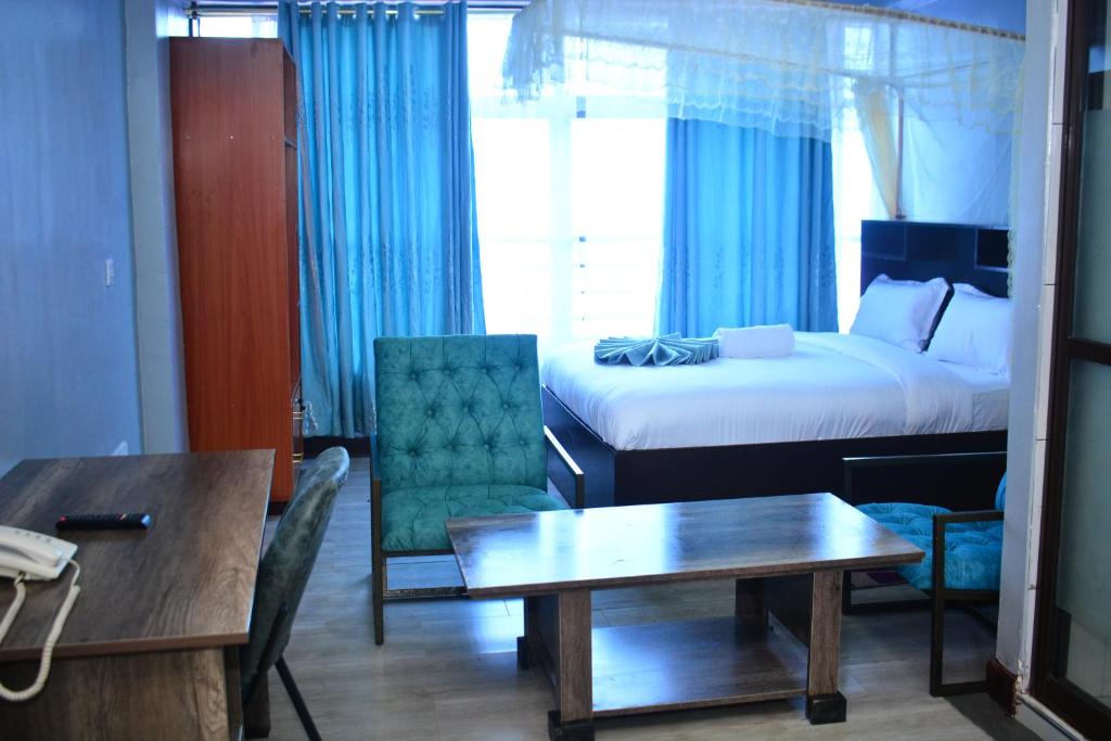 Postel nebo postele na pokoji v ubytování BRIMAK HOTEL