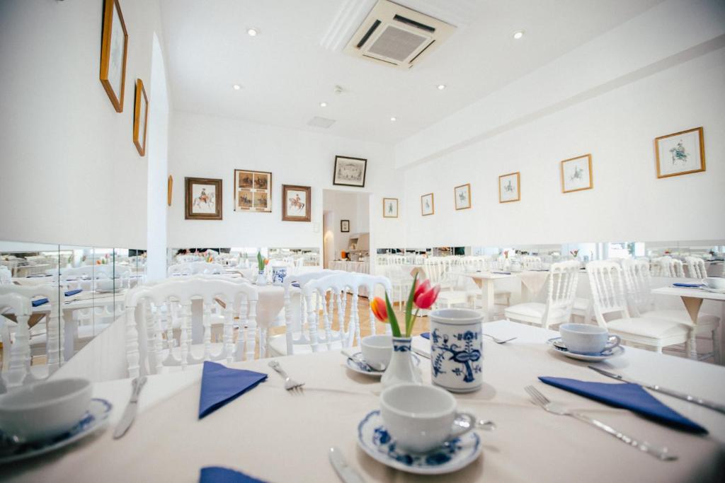 Restoran või mõni muu söögikoht majutusasutuses Boutique Hotel Goldenes Lamm Villach
