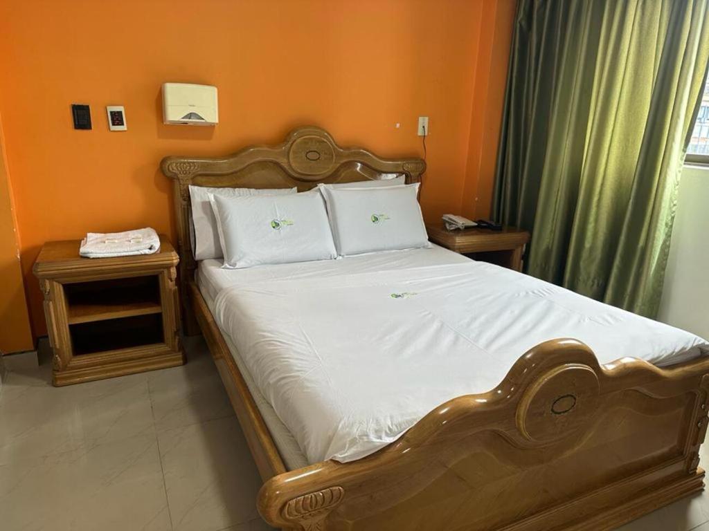 Postel nebo postele na pokoji v ubytování Hotel Bosque Chapinero