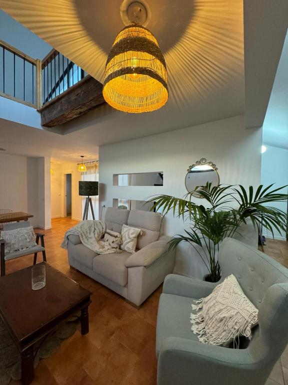 a living room with a couch and a table at Los Patios AT-CC-00962 in Plasencia