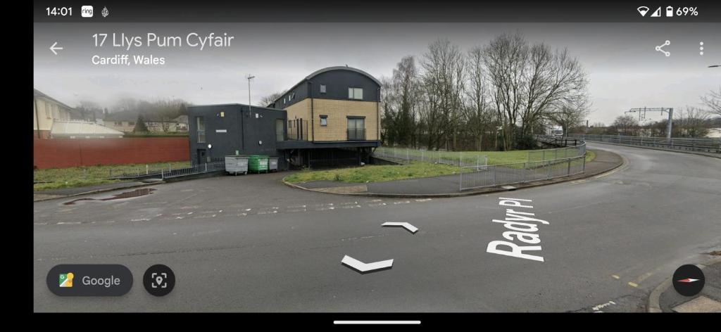 a view of a road with arrows pointing towards a building at Pad in Cardiff