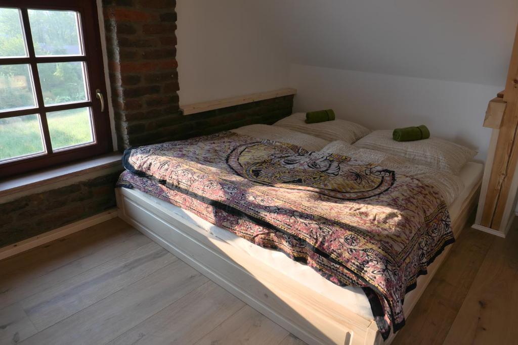 Postel nebo postele na pokoji v ubytování Yogashrama traditional