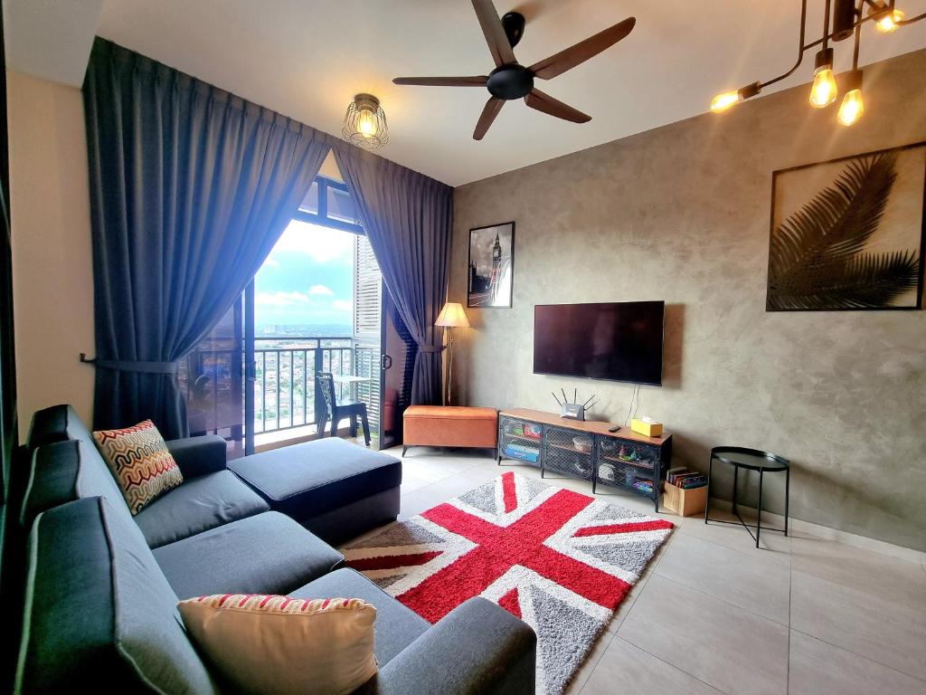 a living room with a couch and a tv at Rustic Retreat 3R2B Infinity Pool/Wifi/Jonker 8min in Melaka