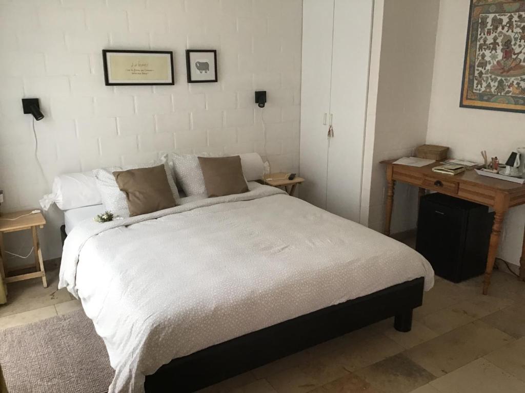 Postel nebo postele na pokoji v ubytování B&B De Kastanjeboom