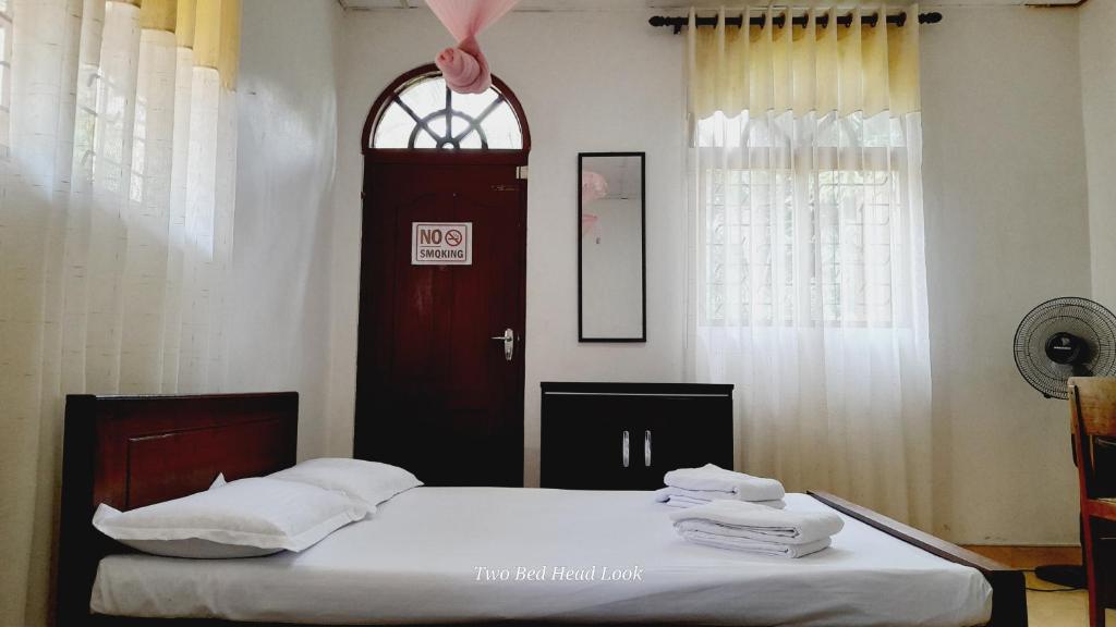 Postel nebo postele na pokoji v ubytování Le Meridien BnB