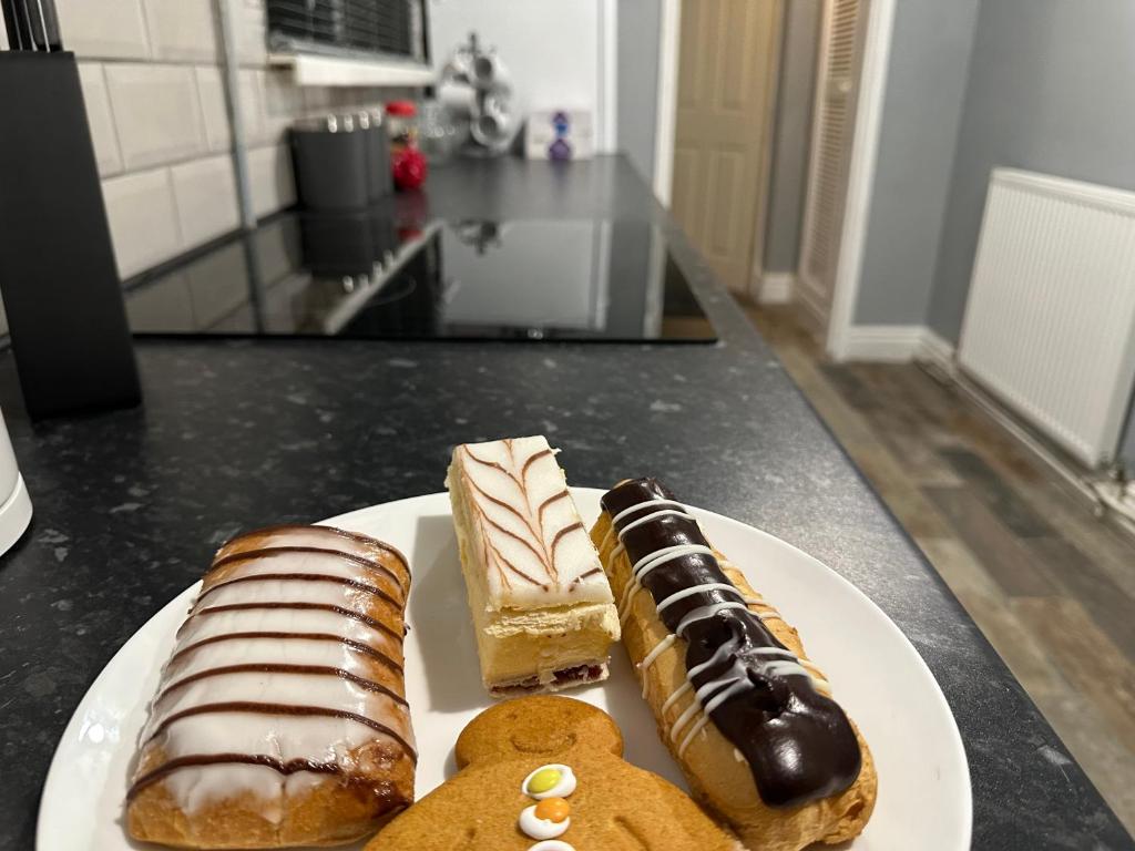 a plate of pastries and cookies on a counter at Robin Hood House in Nottingham