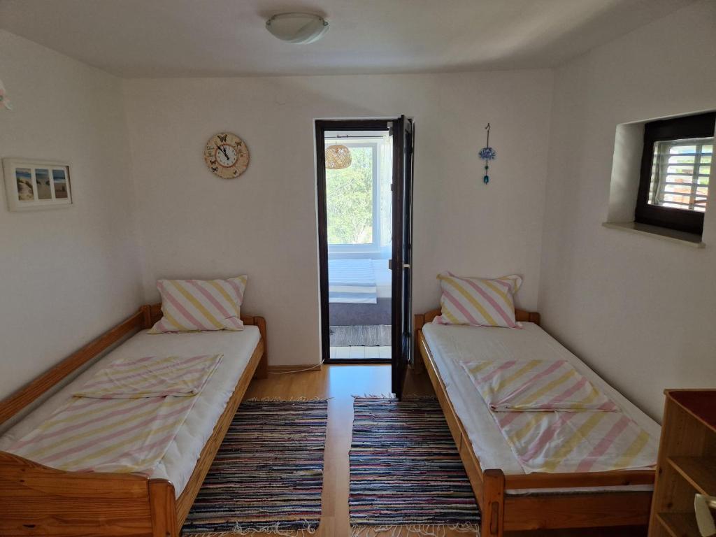 Łóżko lub łóżka w pokoju w obiekcie Apartment Buric