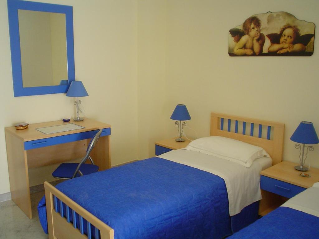 Postel nebo postele na pokoji v ubytování B&B Brezza Marina & Ristorante Shoreline