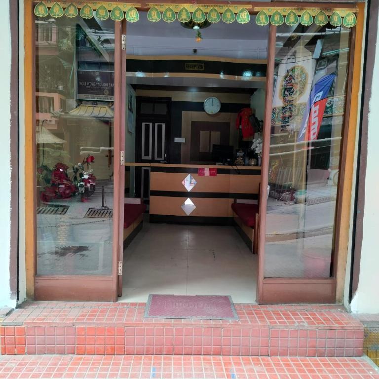 an entrance to a store with glass doors at HOTEL TASHI NORLING Near Mall Road in Gangtok