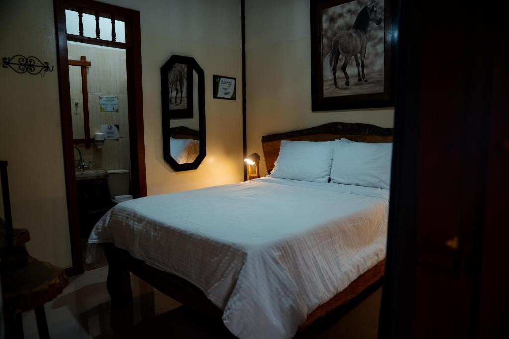 Postel nebo postele na pokoji v ubytování Finca Hotel Yerbabuena