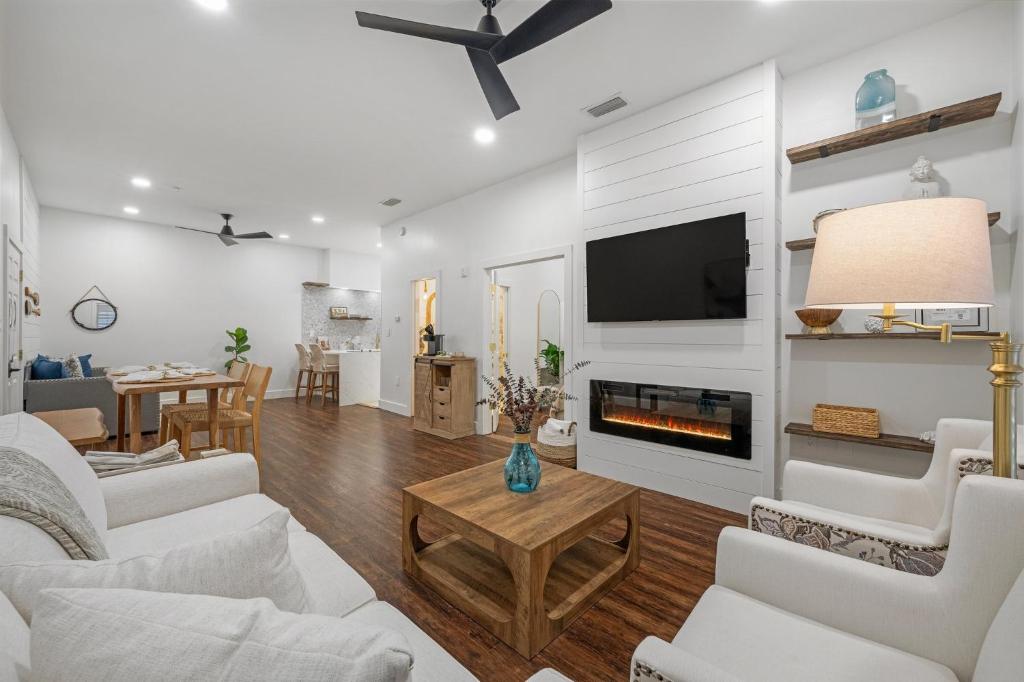 a living room with white furniture and a fireplace at 30A Villages of South Walton B190 - FREE BICYCLES - PRIVATE BEACH ACCESS in Seacrest