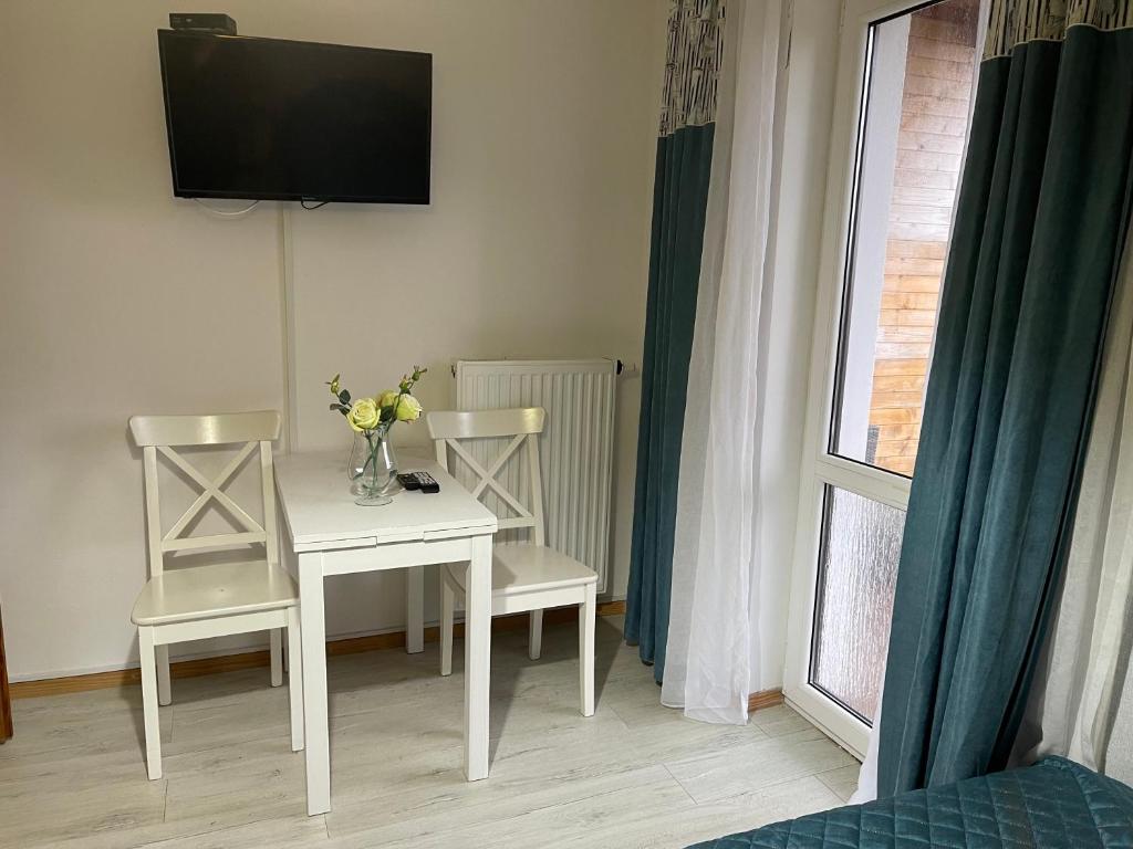TV a/nebo společenská místnost v ubytování Apartamenty Prima