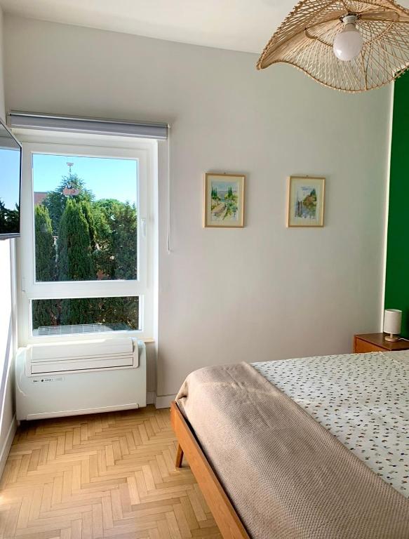 Postel nebo postele na pokoji v ubytování Aurelia House Garden