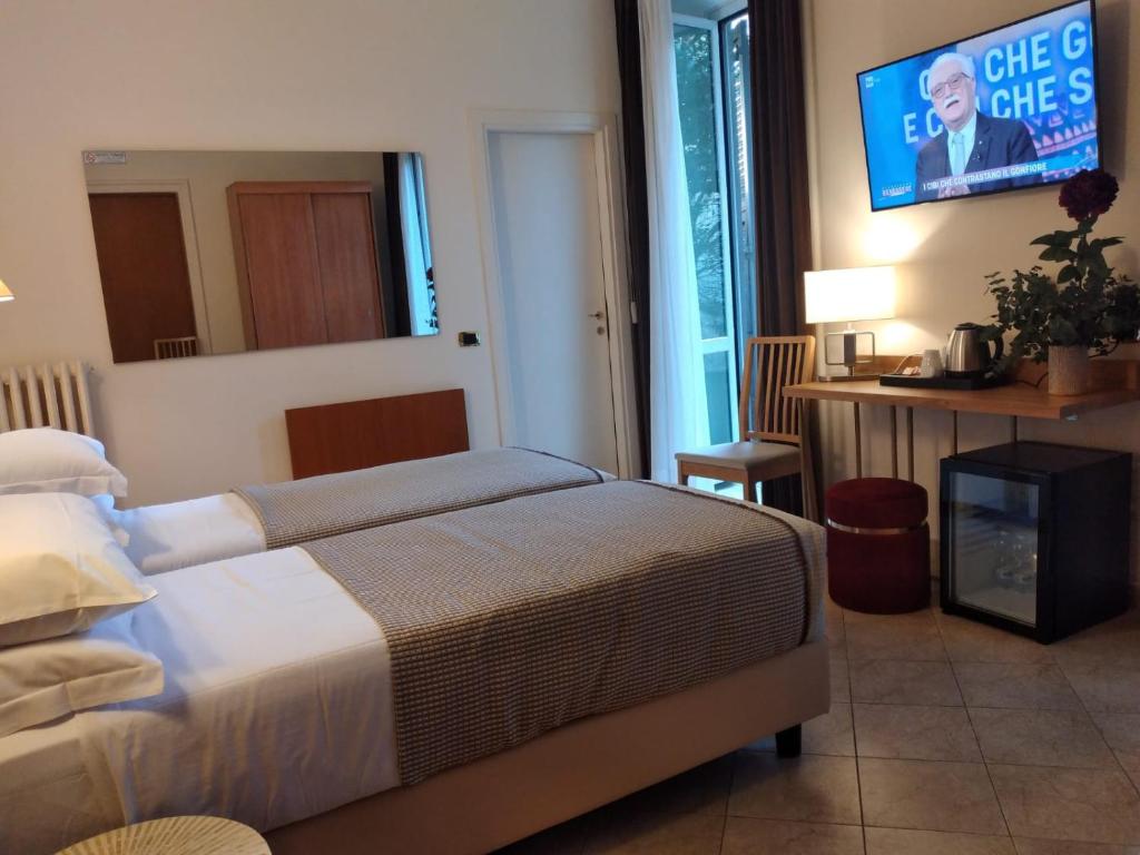 Postel nebo postele na pokoji v ubytování Hotel Principe Eugenio