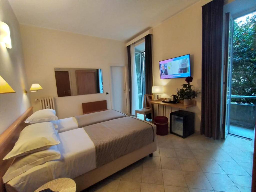 Postel nebo postele na pokoji v ubytování Hotel Principe Eugenio