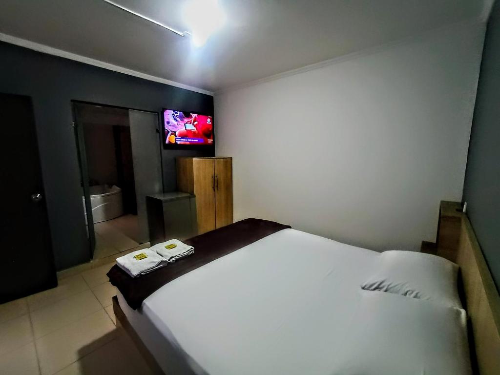 TV a/nebo společenská místnost v ubytování Hotel Ruiseñor Itagui