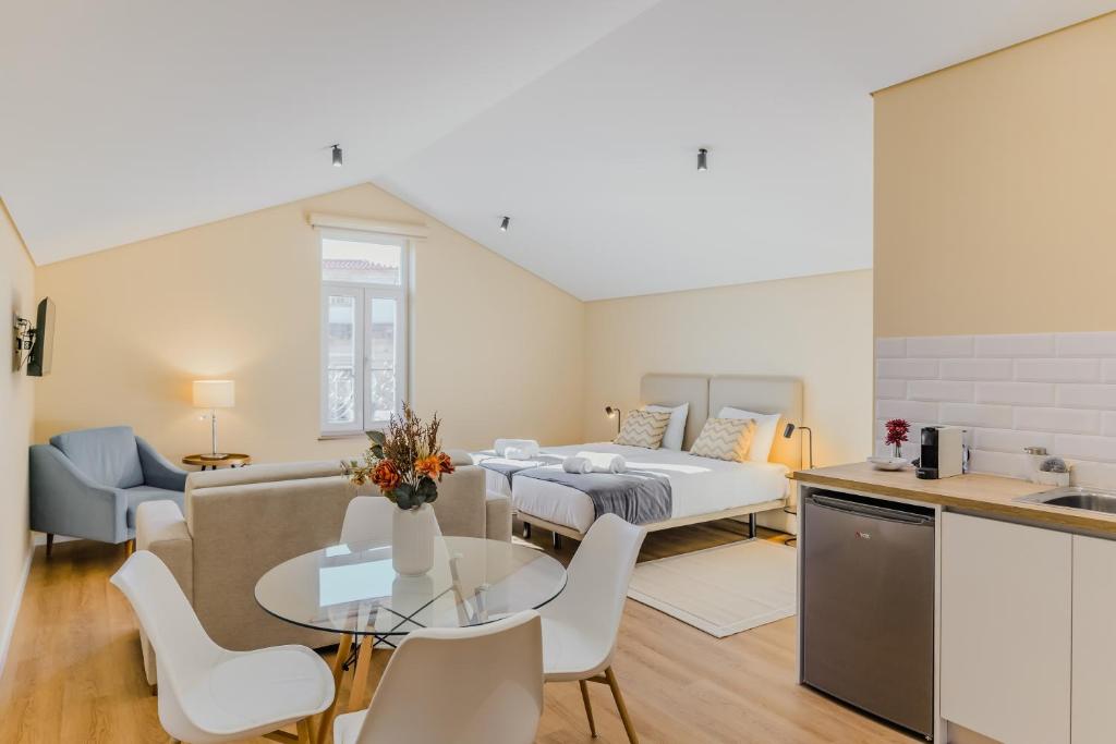 a living room with a couch and a table at Primeiro Quartel Apartments - 5 in Peso da Régua