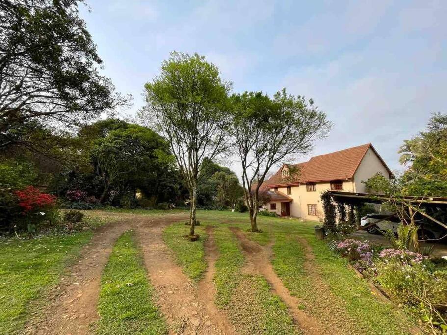 a dirt road in front of a house at Restful Retreat in Hilton