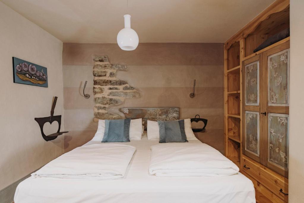 Posteľ alebo postele v izbe v ubytovaní Au coeur du village Chambres d'hôtes & SPA
