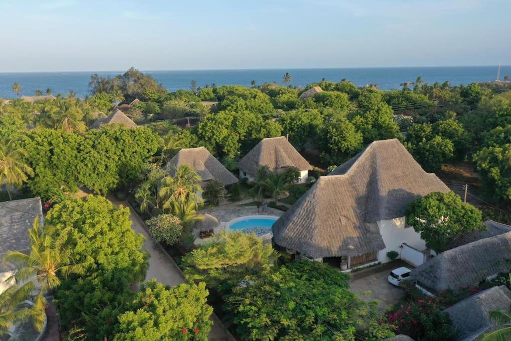 an aerial view of a resort with a pool and trees at Villa Marine Park - Malindi in Malindi