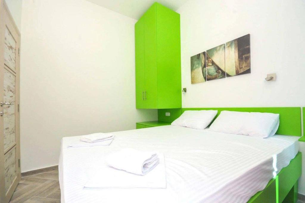 Postel nebo postele na pokoji v ubytování Apartments M Čanj