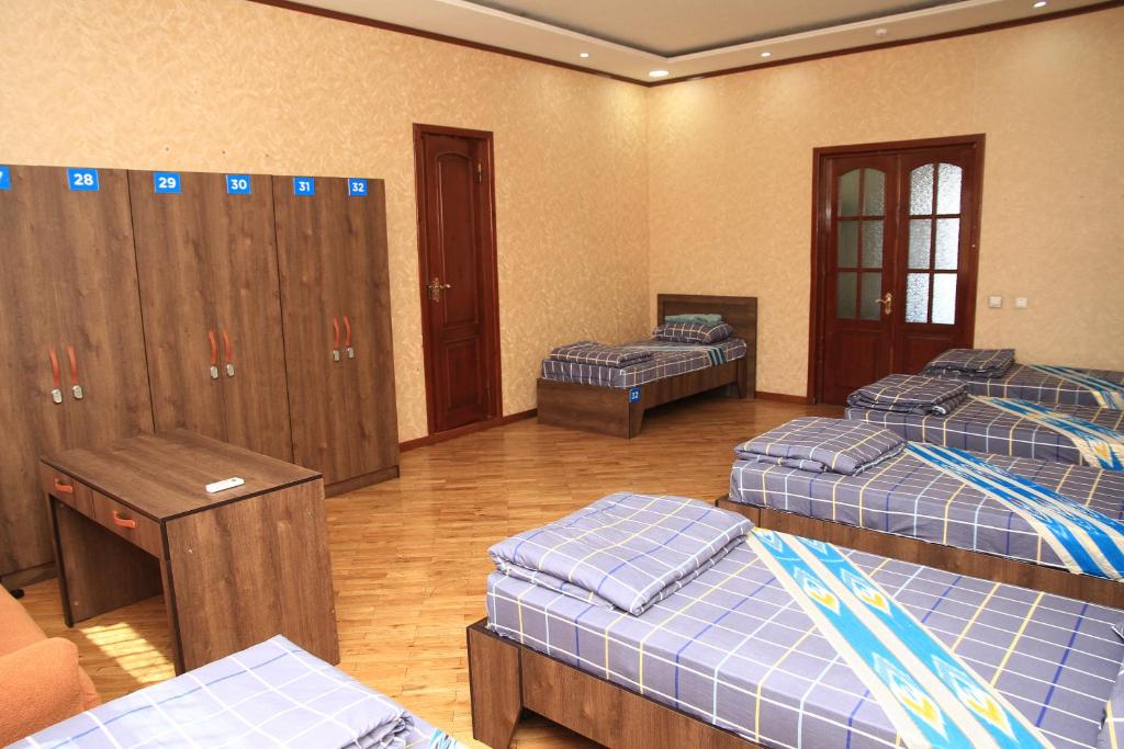 Postel nebo postele na pokoji v ubytování Yellow Hostel Dushanbe