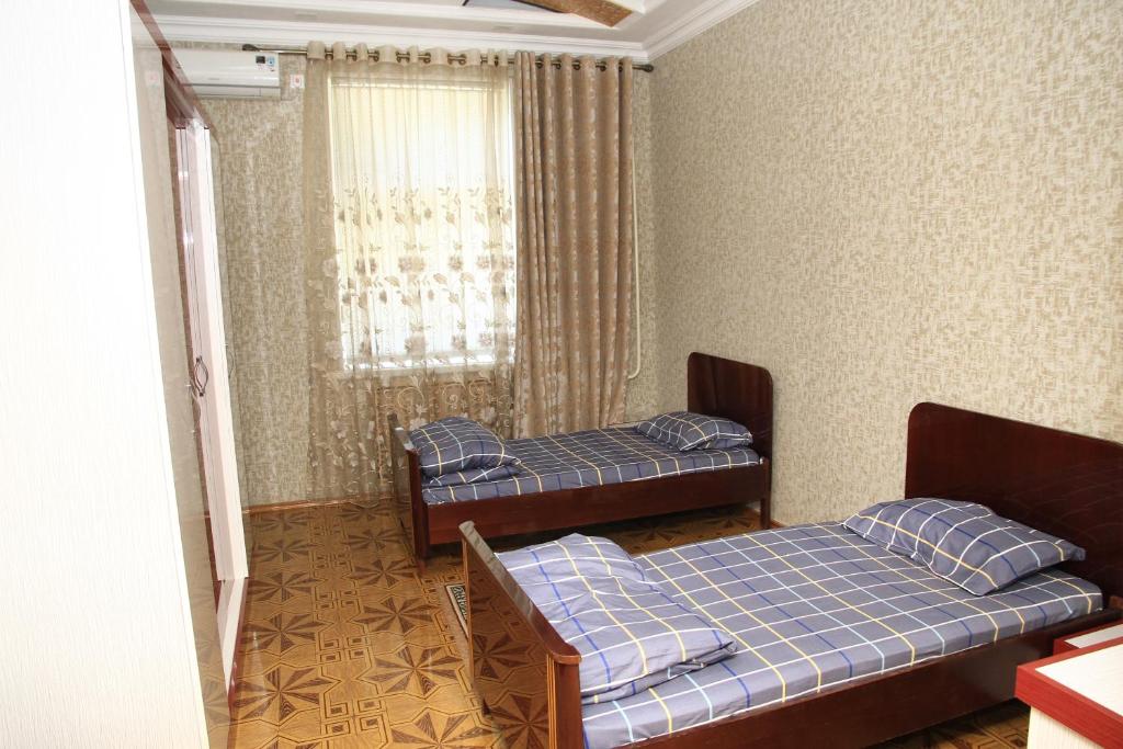 Postel nebo postele na pokoji v ubytování Yellow Hostel Dushanbe