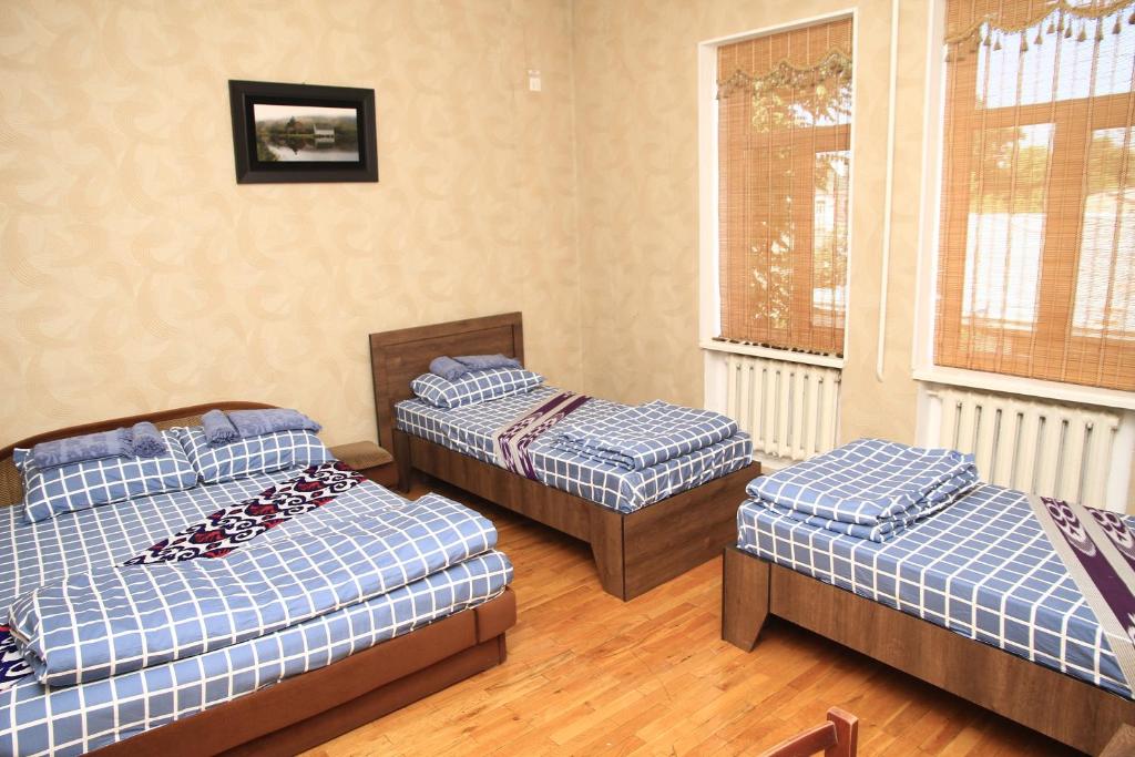 Postel nebo postele na pokoji v ubytování Yellow Hostel Dushanbe