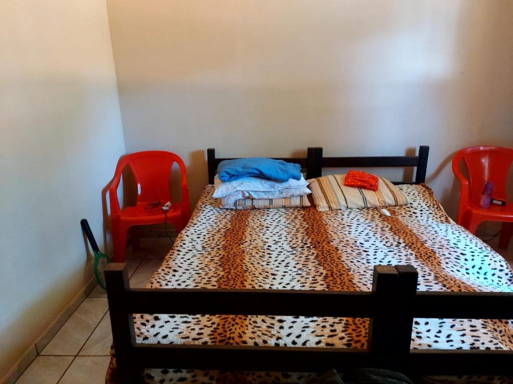 Ένα ή περισσότερα κρεβάτια σε δωμάτιο στο Rancho das Oliveiras