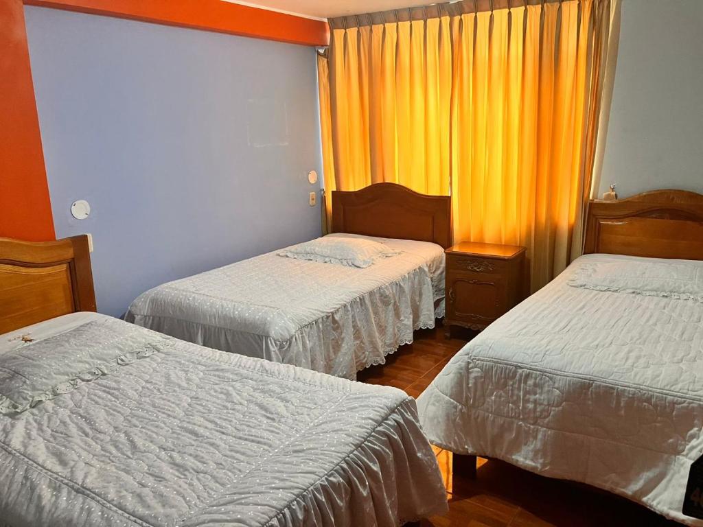 Postel nebo postele na pokoji v ubytování Hostal El Rancho