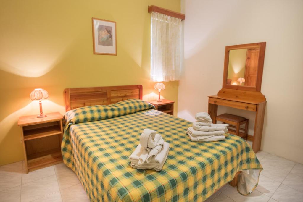 Postel nebo postele na pokoji v ubytování Horizon Apartments Gozo