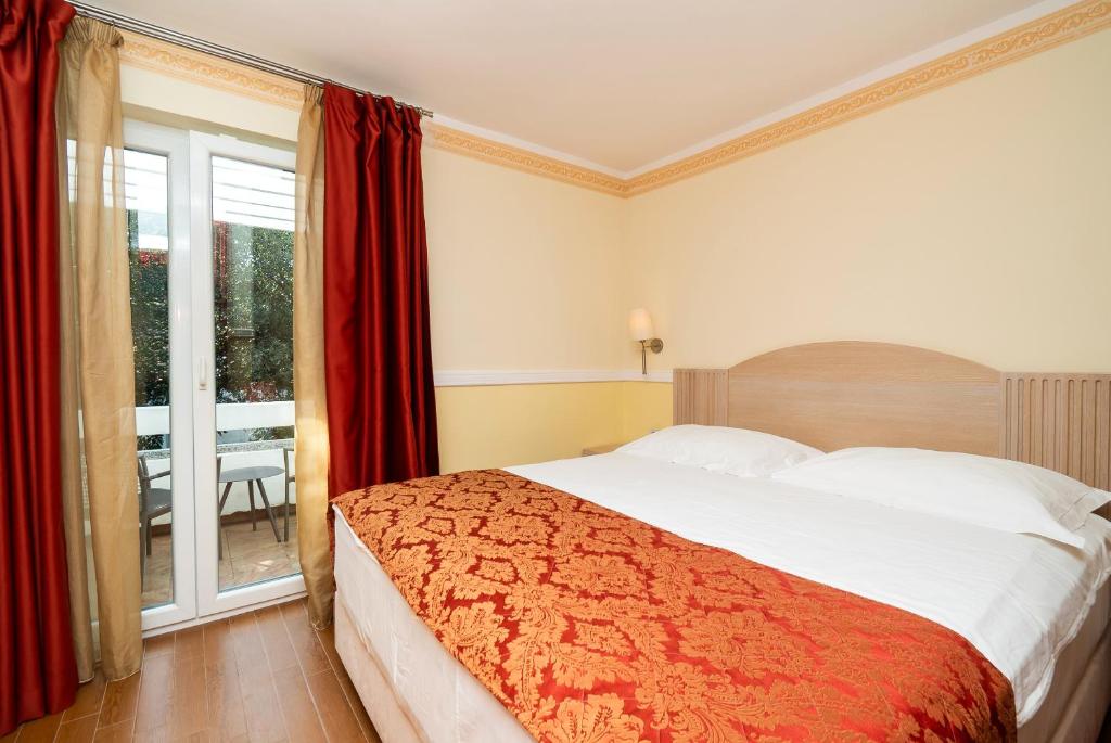 Posteľ alebo postele v izbe v ubytovaní Amadria Park Apartments Šibenik
