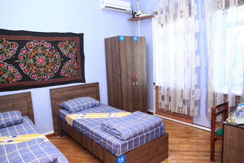 Postel nebo postele na pokoji v ubytování Yellow Hostel Dushanbe