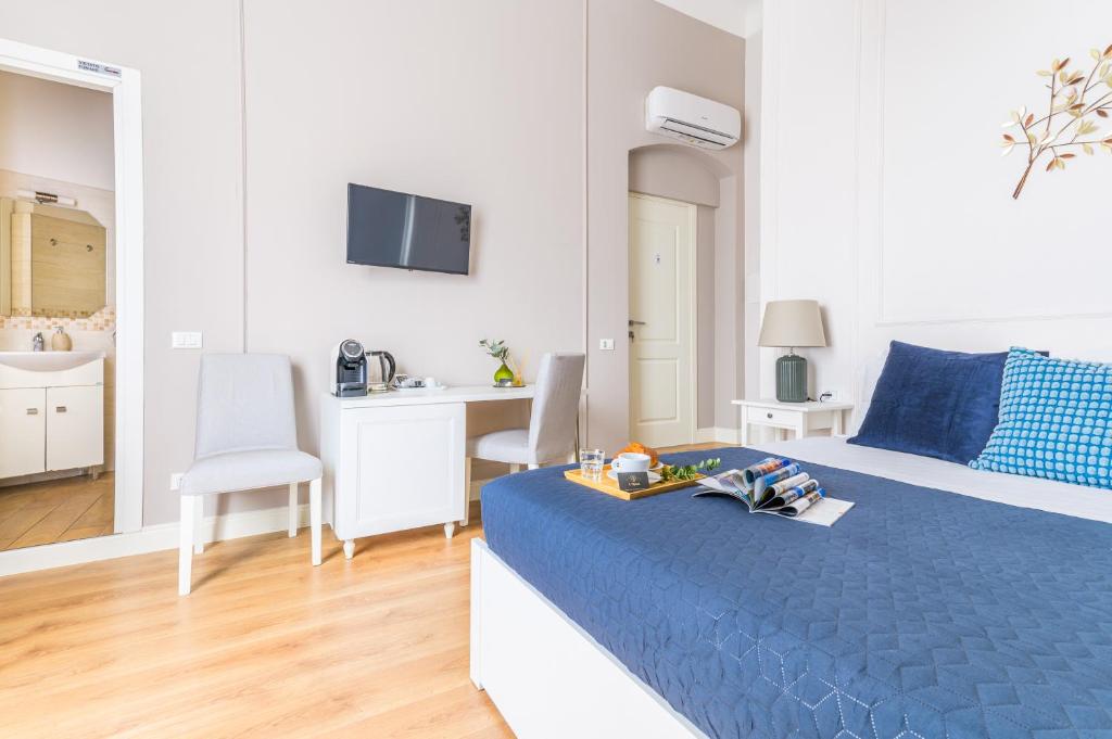 Postel nebo postele na pokoji v ubytování L'Opera Rooms & Suite