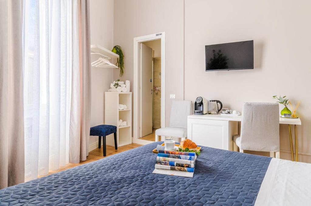 TV a/nebo společenská místnost v ubytování L'Opera Rooms & Suite