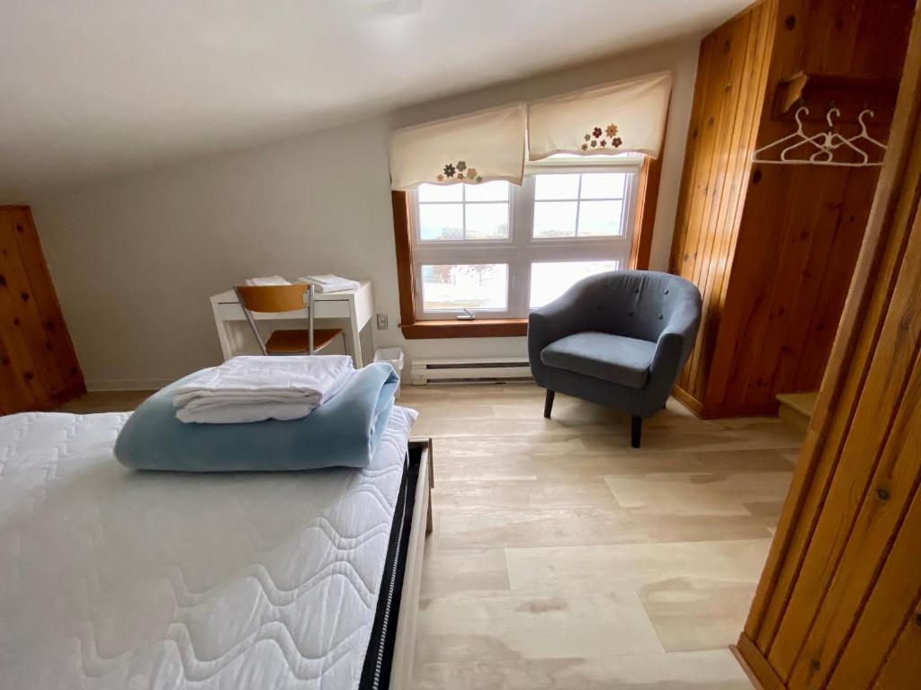 Ένα ή περισσότερα κρεβάτια σε δωμάτιο στο Auberge de Gros-Cap