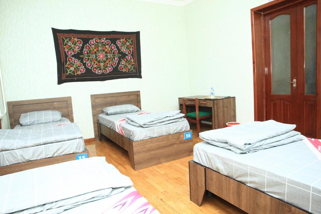 Postel nebo postele na pokoji v ubytování Yellow Hostel Dushanbe