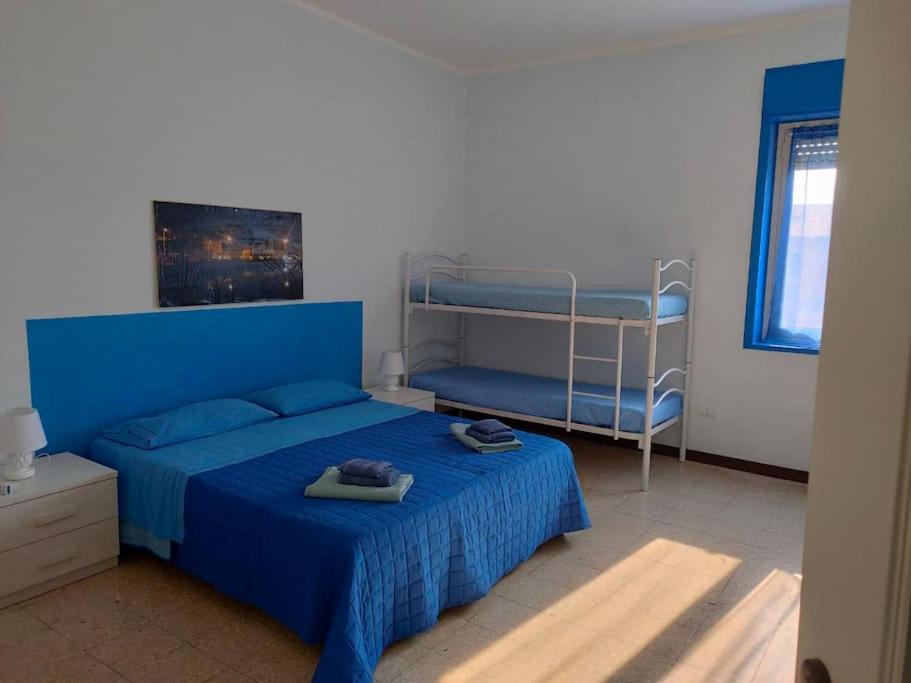 En eller flere senge i et værelse på Casa Vacanza Nautilus