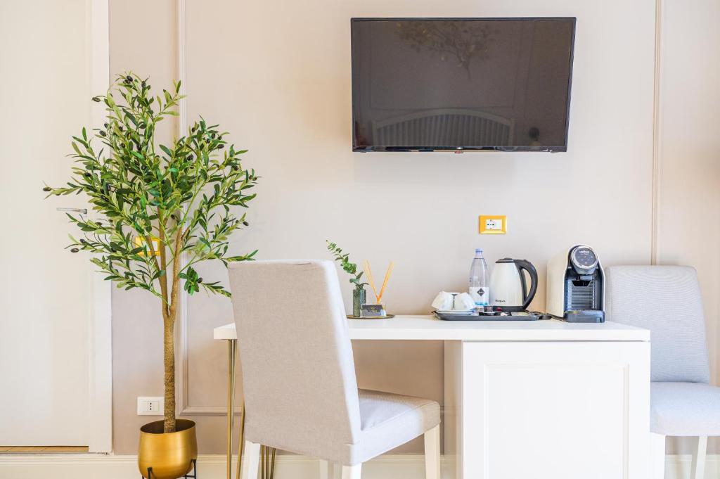 TV a/nebo společenská místnost v ubytování L'Opera Rooms & Suite
