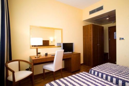 Posteľ alebo postele v izbe v ubytovaní Hotel Marconi
