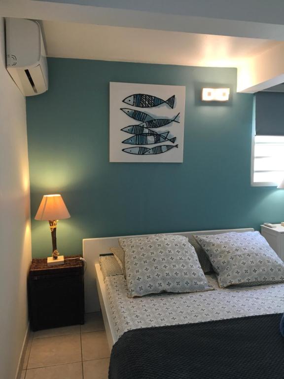 Postel nebo postele na pokoji v ubytování Appartement style Caribeen