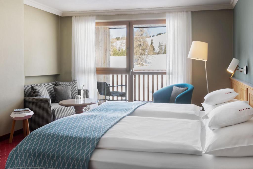 Postel nebo postele na pokoji v ubytování ICARO Hotel