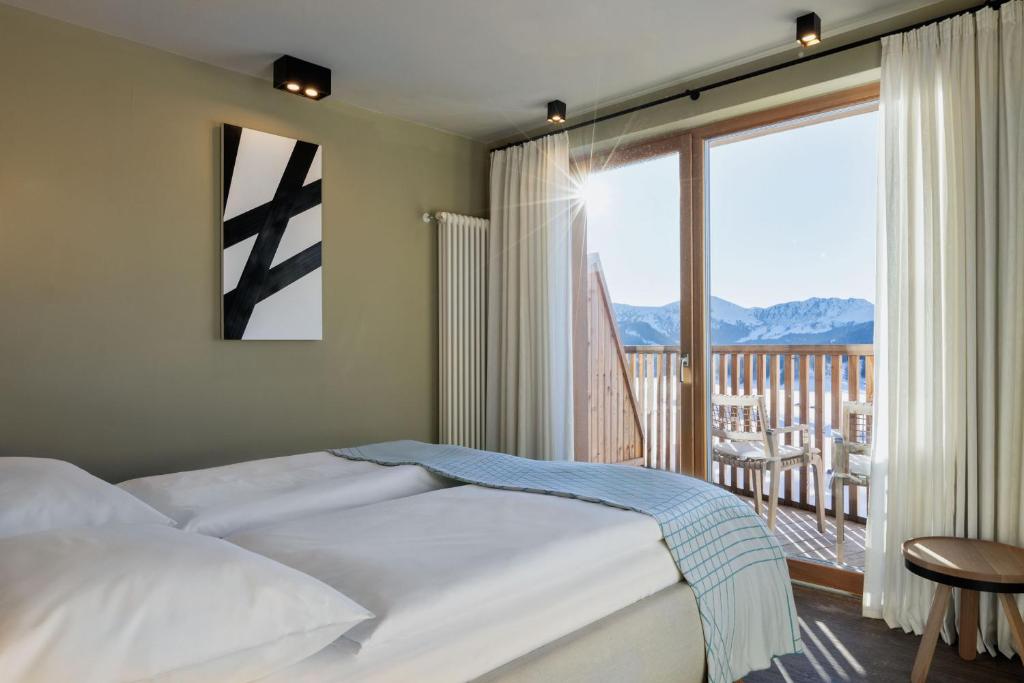 Postel nebo postele na pokoji v ubytování ICARO Hotel