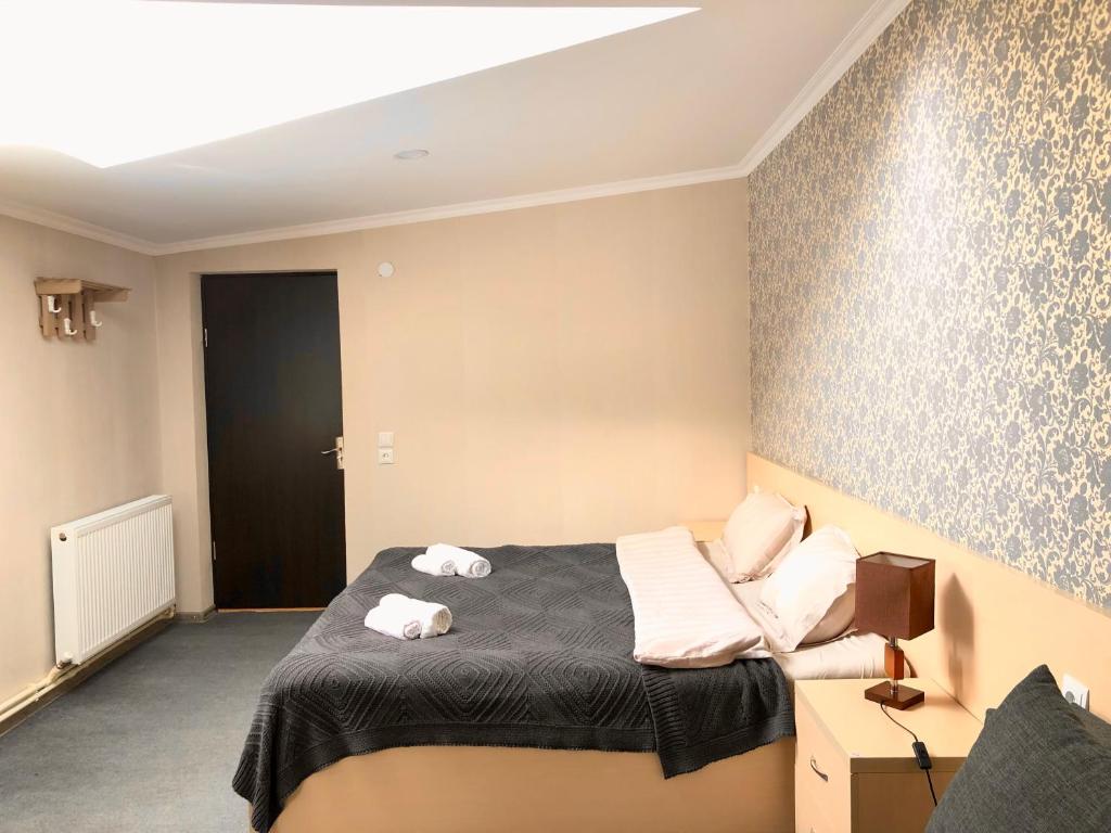 Postel nebo postele na pokoji v ubytování Guest House Vanda