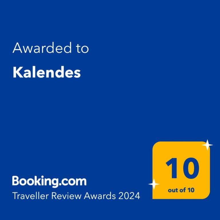 a yellow sign that reads awarded to kalabies at Kalendes in Kalandra