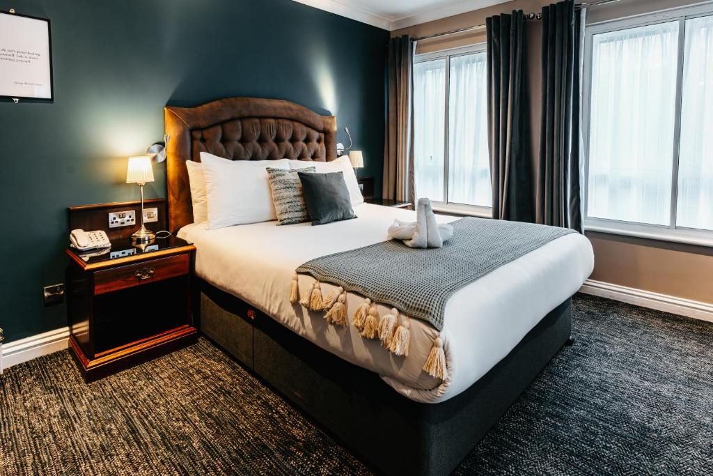 a bedroom with a large bed in a room at Drury Court Hotel in Dublin