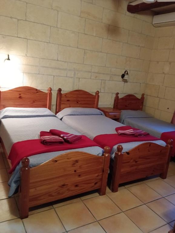 Letto o letti in una camera di Ortensia